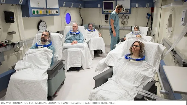 Patients receiving hyperbaric oxygen therapy in a multiplace chamber