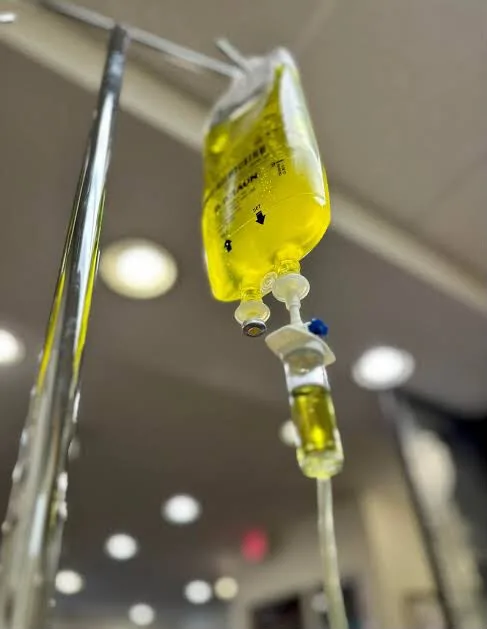 Yellow IV infusion bag and drip chamber