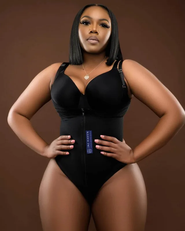 Model wearing a black J&J Haven faja compression garment